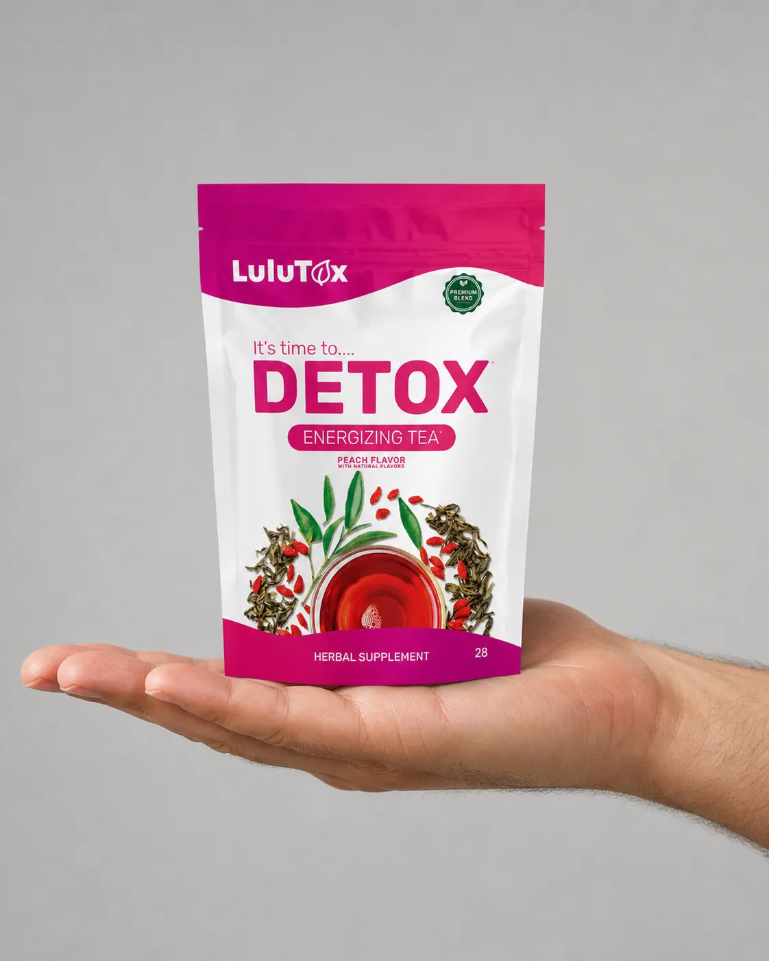 Lulutox Detox Tea HCTC — the package held in a hand